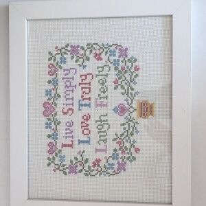 Handmade cross-stitch wall art